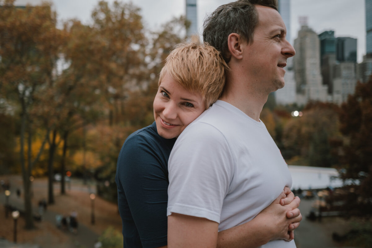 Couple embracing in Central Park in autumn, engagement session in New York